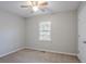Cozy bedroom with a ceiling fan, neutral paint, and a sunlit window offers a relaxing space at 3094 Calumet Nw Cir, Kennesaw, GA 30152
