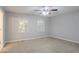 Spacious bedroom with natural light from two windows and a ceiling fan offers a serene atmosphere at 3094 Calumet Nw Cir, Kennesaw, GA 30152