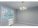 Bright dining area featuring neutral paint, updated light fixture, and natural light at 3094 Calumet Nw Cir, Kennesaw, GA 30152