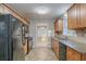 Open kitchen design featuring granite countertops, tile backsplash, and stainless steel appliances at 3094 Calumet Nw Cir, Kennesaw, GA 30152