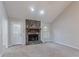 Open living room featuring a cozy stone fireplace, vaulted ceilings, and natural light at 3094 Calumet Nw Cir, Kennesaw, GA 30152