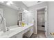 Bathroom featuring double sinks, large mirrors, and a separate shower area at 3823 Briarstone Cv, Snellville, GA 30039