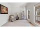 Cozy bedroom with neutral carpet, natural light, a comfortable chair, and a wooden dresser at 3823 Briarstone Cv, Snellville, GA 30039
