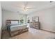 Bedroom with a rustic wooden bed frame, contemporary dresser, and cozy atmosphere features natural light at 3823 Briarstone Cv, Snellville, GA 30039