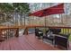 Outdoor deck with seating overlooking the beautiful fenced in pool area at 3823 Briarstone Cv, Snellville, GA 30039
