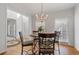 Dining room featuring a chandelier and hardwood floors at 3823 Briarstone Cv, Snellville, GA 30039