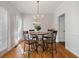 Dining room with chandelier and hardwood floors at 3823 Briarstone Cv, Snellville, GA 30039