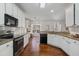 Kitchen showcasing granite countertops and stainless appliances at 3823 Briarstone Cv, Snellville, GA 30039