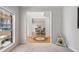 The open-concept living room boasts wood floors and leads to the dining area, creating a seamless flow at 3823 Briarstone Cv, Snellville, GA 30039