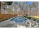 Private in-ground swimming pool with surrounding deck and lounge chairs at 3823 Briarstone Cv, Snellville, GA 30039