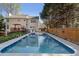 Backyard swimming pool with a spacious deck and privacy fence, perfect for outdoor relaxation and entertainment at 3823 Briarstone Cv, Snellville, GA 30039