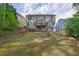 The backyard features a deck, trees, and ample space for relaxation and outdoor activities at 4005 Saddlebrook Creek Dr, Marietta, GA 30060