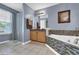 Bright bathroom featuring tile floors, double sinks, and soaking tub at 4005 Saddlebrook Creek Dr, Marietta, GA 30060