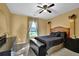 Bedroom featuring a decorative bed frame, bedside table, and dark furnishings at 4005 Saddlebrook Creek Dr, Marietta, GA 30060