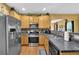 Kitchen featuring stainless steel appliances, tiled backsplash, and granite countertops at 4005 Saddlebrook Creek Dr, Marietta, GA 30060