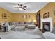 Spacious living room with a fireplace, plush sectional and natural light at 4005 Saddlebrook Creek Dr, Marietta, GA 30060