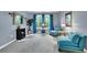 Bright living room with blue walls, blue chairs and neutral carpet at 4005 Saddlebrook Creek Dr, Marietta, GA 30060