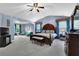 Spacious main bedroom boasts a vaulted ceiling, sitting area, and elegant furnishings at 4005 Saddlebrook Creek Dr, Marietta, GA 30060