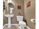 Simple powder room featuring a pedestal sink and standard toilet at 4005 Saddlebrook Creek Dr, Marietta, GA 30060