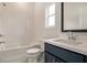 Bathroom featuring modern fixtures, a combination shower and tub, and a single-sink vanity at 7785 Wild Violet Dr, Cumming, GA 30040