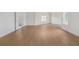 Bright and spacious bedroom with light wood floors and access to an ensuite bathroom at 7785 Wild Violet Dr, Cumming, GA 30040