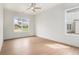 Bright, airy bedroom with large windows providing abundant natural light and scenic views at 7785 Wild Violet Dr, Cumming, GA 30040