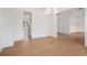 Open-concept dining area featuring hardwood floors and lots of natural light at 7785 Wild Violet Dr, Cumming, GA 30040