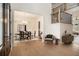 Welcoming entryway with hardwood floors, dining room view, and elegant staircase at 7785 Wild Violet Dr, Cumming, GA 30040