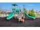 Community playground featuring a green and orange play structure for children to enjoy at 7785 Wild Violet Dr, Cumming, GA 30040