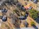 Aerial view of neighborhood with mature trees and large lot at 105 Ruff Harris Dr, Dallas, GA 30157