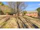 Expansive backyard with mature trees and a partially fenced perimeter at 105 Ruff Harris Dr, Dallas, GA 30157