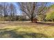 A large backyard area with a small shed in the background at 105 Ruff Harris Dr, Dallas, GA 30157