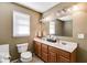 Bathroom featuring double sinks, wood cabinets, and neutral paint at 105 Ruff Harris Dr, Dallas, GA 30157