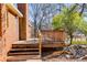 A cozy wooden deck overlooks the backyard and mature trees at 105 Ruff Harris Dr, Dallas, GA 30157