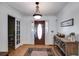 Warm foyer with hardwood floors, decorative console table, and an elegant front door at 105 Ruff Harris Dr, Dallas, GA 30157