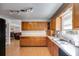 Bright kitchen featuring wood cabinets, plenty of counter space, and hardwood flooring at 105 Ruff Harris Dr, Dallas, GA 30157