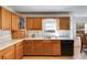 Kitchen featuring wood cabinets, white countertops, and stainless steel appliances at 105 Ruff Harris Dr, Dallas, GA 30157