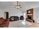 Bright living room featuring a brick fireplace, vaulted ceilings, and comfortable seating at 105 Ruff Harris Dr, Dallas, GA 30157