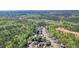 Overhead view of the neighborhood, showcasing single-Gathering homes with beautifully maintained lawns and tree-lined streets at 302 Grant Ct, Canton, GA 30114