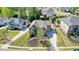 Aerial view of a beautiful home with well-manicured lawn and mature trees in a residential neighborhood at 302 Grant Ct, Canton, GA 30114
