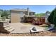 Landscaped backyard with a brick paved patio, outdoor kitchen, and a wooden pergola for relaxation at 302 Grant Ct, Canton, GA 30114