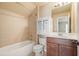Bathroom with white cabinet, shower, bath and neutral wall and floor tile at 302 Grant Ct, Canton, GA 30114