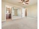 Large carpeted bedroom with connected bathroom and large wall mirror at 302 Grant Ct, Canton, GA 30114