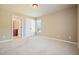 Spacious bedroom with neutral walls, carpet and a view into the en suite bathroom at 302 Grant Ct, Canton, GA 30114