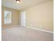 Cozy carpeted bedroom features natural light from the window and neutral walls at 302 Grant Ct, Canton, GA 30114