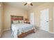 Comfortable bedroom featuring a rustic wooden bed frame and a soft, neutral color palette at 302 Grant Ct, Canton, GA 30114