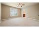 Large carpeted bedroom with attached bath and window to the back yard at 302 Grant Ct, Canton, GA 30114