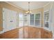 Sunlit breakfast nook with hardwood floors and large windows offering views of the backyard at 302 Grant Ct, Canton, GA 30114