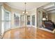Bright breakfast nook featuring hardwood floors, wainscoting and large windows overlooking the backyard at 302 Grant Ct, Canton, GA 30114