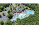 Aerial view of a community pool with a waterslide and community center at 302 Grant Ct, Canton, GA 30114